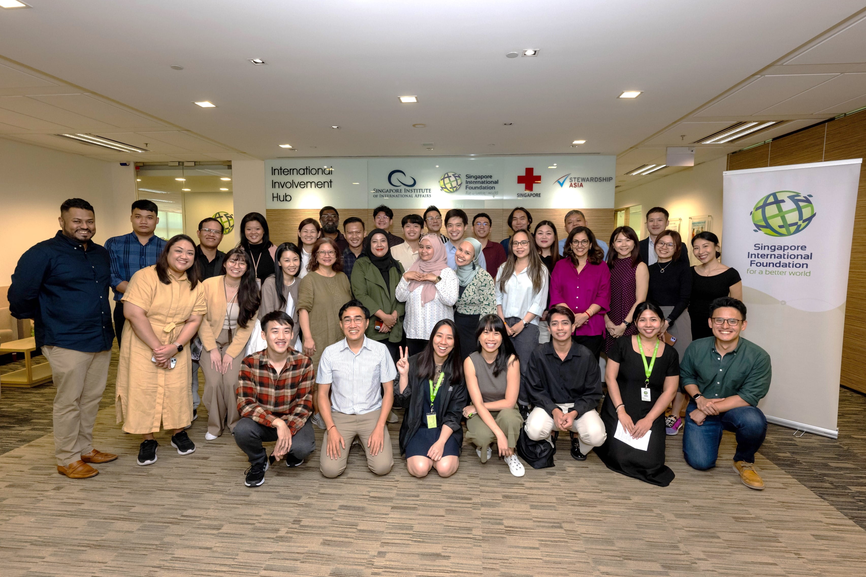 Group photo at the Welcome Lunch in the SIF office